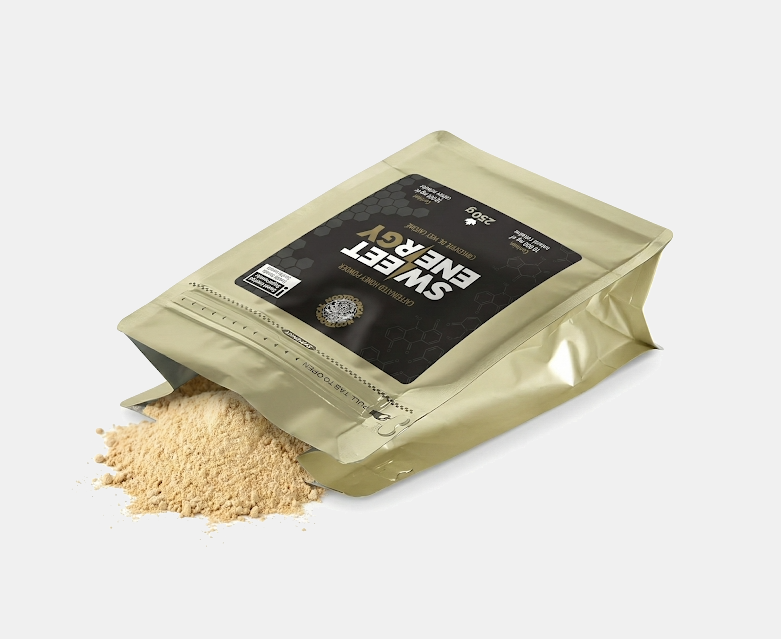 Gold packaging of Sweet Energy caffeinated honey powder with a black label.